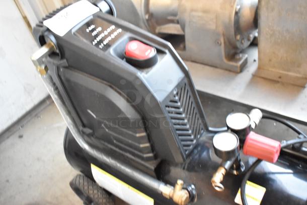 Husky 0300813A 8 Gal. 150 PSI oil-free portable air compressor, black, rubber wheels, visible control panel, used condition.