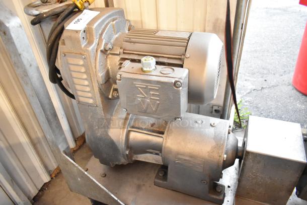 Waukesha Pump Metal Compressor in industrial setting; appears in good condition with visible SEW marking on the casing.