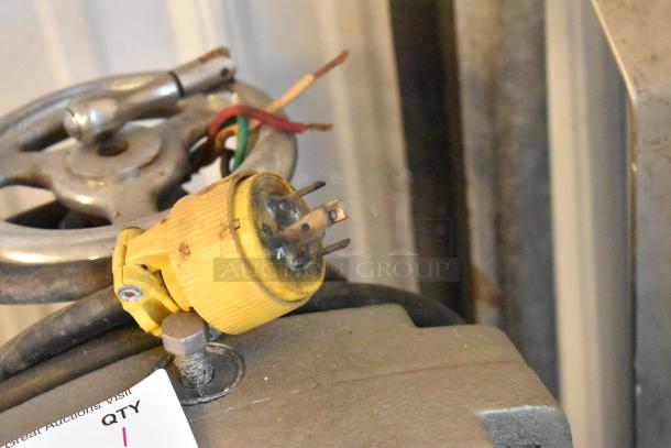 Waukesha Pump Metal Compressor with yellow power plug and visible wiring. Slight wear on metal, indicative of used condition.