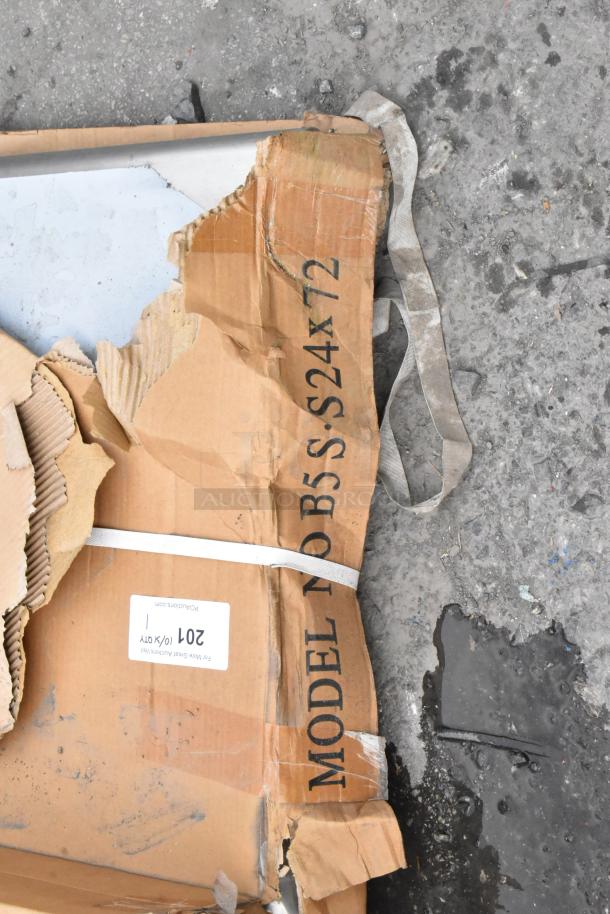 BRAND NEW SCRATCH AND DENT! B5S-S24X72 Stainless Steel Table in damaged packaging, label visible on cardboard box.