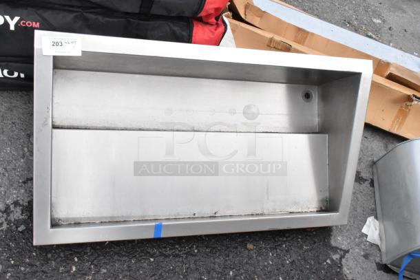 Stainless steel drop-in unit, rectangular design, shows signs of use. Tag reads "203" with vendor information.