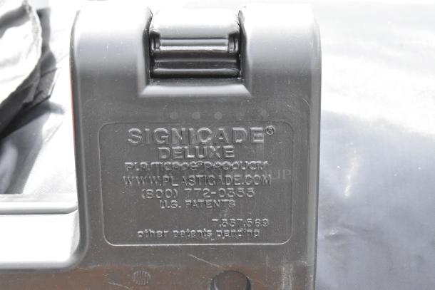 Black Signicade Deluxe A Frame Sidewalk Sign in poly material. Features manufacturer's label and US patent information.