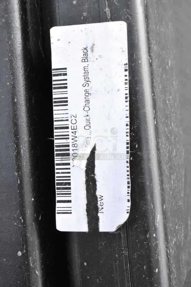 Black poly A-frame sidewalk sign with barcode label indicating quick change system. Worn condition with visible scuffs.