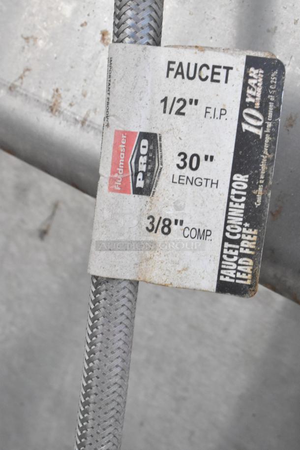 Fluidmaster Pro faucet connector tag, showing 1/2" F.I.P., 30" length, 3/8" comp., lead-free, 10-year warranty.