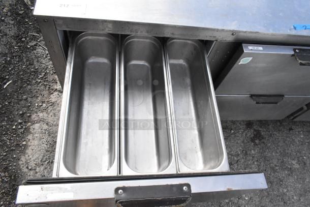 Stainless steel commercial cooler with 4 drawers, 1 door, and casters; 115 Volts, 1 Phase. Ideal for undercounter use.