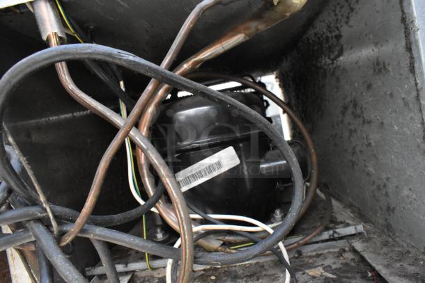 Stainless steel commercial undercounter cooler with 4 drawers, 1 door, on casters. Powered by 115 volts, 1 phase.