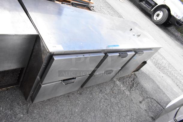 Stainless steel undercounter cooler with 4 drawers, 1 door, and commercial casters. 115 volts, 1 phase. Minor surface wear.