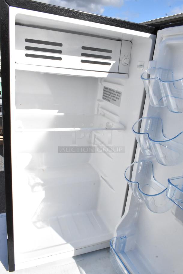 Five mini coolers, including Frigidaire EFR331-BLACK-6COM, GE, Frigidaire EFR780-6COM, Galanz GLR31TS1E02, Frigidaire FGFR334, 115V, 1 phase. Open door view with interior shelving and clear door racks.