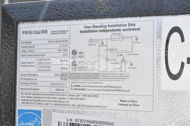 Frigidaire EFR331-BLACK-6COM label showing specs: 3.2 Cu.Ft., 115V, model manufactured in 2023. Features include energy efficiency and design pressure details.
