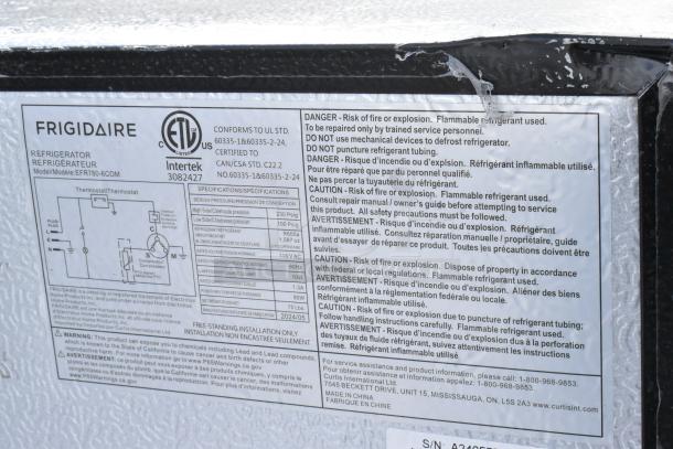 Close-up of Frigidaire EFR780-6COM cooler label detailing safety warnings, specifications, and electrical information.