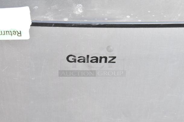 Galanz mini cooler, metallic finish with visible brand logo. Includes return label. Part of a set of 5 various mini coolers.