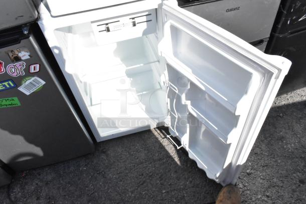 Six mini coolers, including Galanz GL31S5, Whirlpool WH35S1E, Summit FS22L. White interiors, 115V, with custom decals.