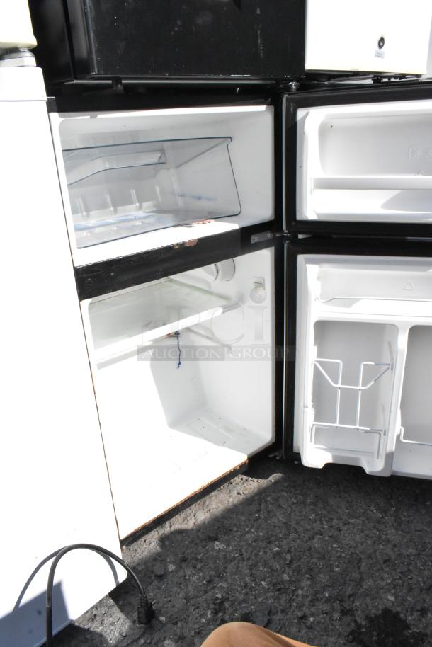 Six mini coolers including Galanz GL31S5 and Whirlpool WH35S1E. Open doors display interior storage. 115V, 1 Phase.