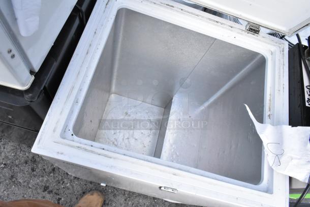 Open Hisense WFC050M6XWD chest freezer, white interior, visible wear, part of a lot with 4 mini coolers, 115 volts, 1 phase.