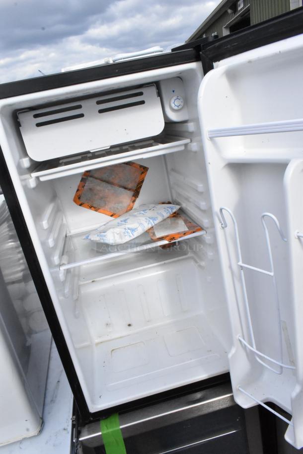 Open mini cooler showing interior shelves and temperature dial, part of a set including Tramontonia 80901/100, EdgeStar CMF151L-1, Galanz GL43S5. 115 Volts, 1 Phase.