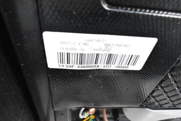Label showing Arctic King model ARV115B1AST, 115 volts, 1 phase. Serial 54F-3300000A, R600a refrigerant listed.