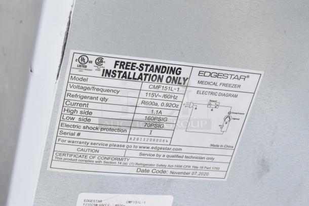 Label on EdgeStar CMF151L-1 mini cooler indicating 115V, 60Hz, R600a refrigerant. Made in China, free-standing installation.