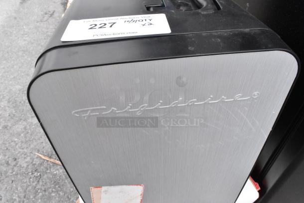 Frigidaire EFMIS183-SS Mini Cooler, dual power DC 12V/AC 120V, brushed metal finish. Includes auction label "227 x2".