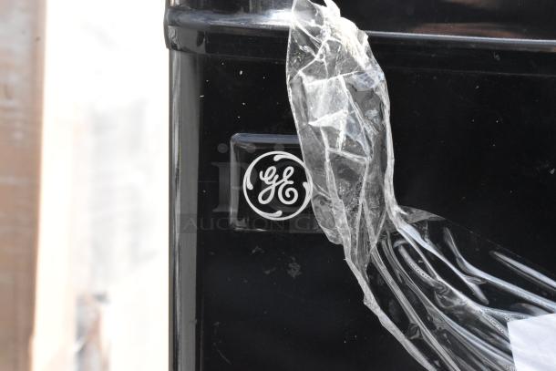 4 mini coolers including GE WMR04BAPBB, Galanz GLR31TS1E02, GLR33MBKE23, Whirlpool WH31S1E, 115V, visible GE logo.