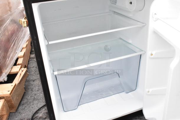 Mini cooler interior with glass shelves and spacious design, part of a 4-pack auction including Galanz, GE, and Whirlpool models.