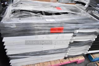 39 folding chairs stacked and wrapped on pallets, visible labels indicating item number and condition.
