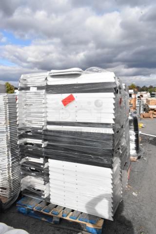 Stack of folding chairs, wrapped and stacked on pallets. Includes labels with red tags. Auction of 90 items total.