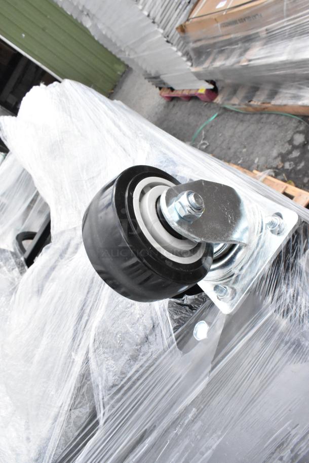 Brand new Lavex 475UAG153FRME black poly tilt truck, 1650 lb capacity, visible caster assembly, partially wrapped, minor dents.