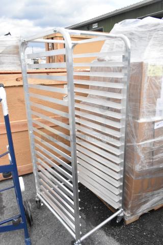 BRAND NEW Metro RT183N 18 Pan End Load Bun / Sheet Pan Rack with commercial casters, some scratches/dents visible.