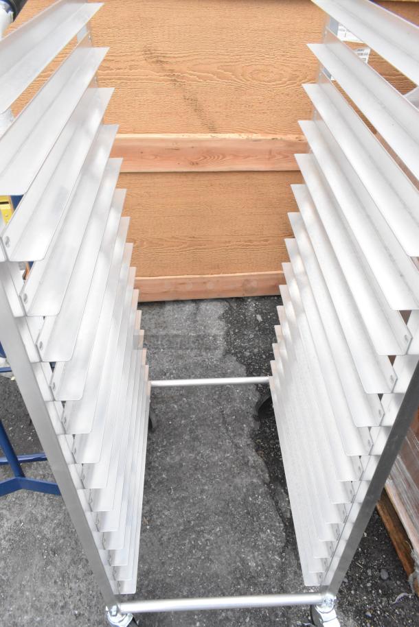 BRAND NEW Metro RT183N 18 Pan Rack, scratch and dent, end load, commercial casters, anodized aluminum frame.