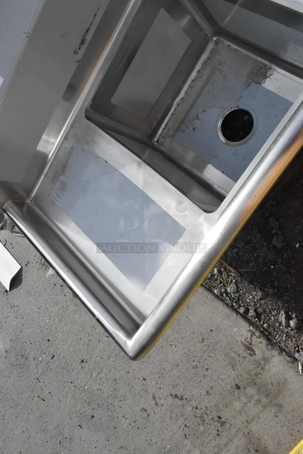 Alt text: Regency 600S31416212 stainless steel three compartment sink, 70", with two drainboards. New scratch and dent. No legs.