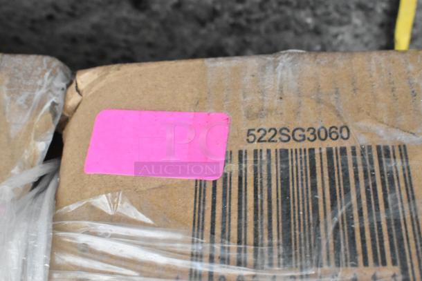 Cardboard box with pink sticker and barcode. Markings include "522SG3060," indicating a Steelton 30" x 60" equipment stand.