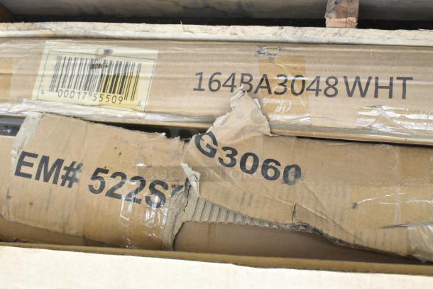 Cardboard boxes displaying product codes: 164BA3048WHT, 522SG3060. Items are new with some packaging damage. Includes Vevor FG-SKU10 Ice Chest, Steelton Equipment Stand, and other tables.