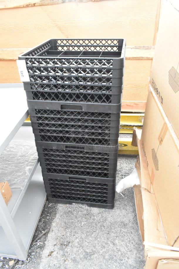 Four new black poly dish caddies stacked, showing durable lattice design. Slight scratches noted. Marked "245" on side.