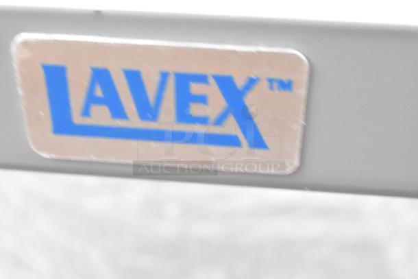 Lavex gray metal 3-tier cart with commercial casters. Brand label visible. New with scratch and dent condition.