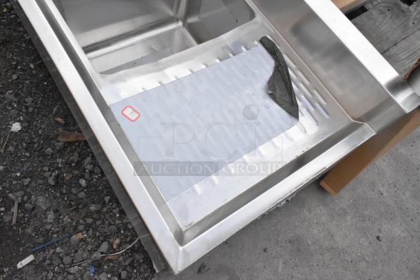 Brand new Regency 600B41014213 4-bowl underbar sink, 72"x18.75", with two drainboards, minor scratches and dents.