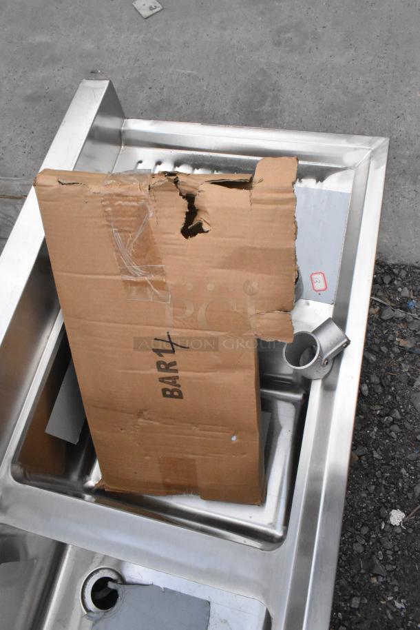 BRAND NEW Regency 4-bowl underbar sink, 72"x18.75", scratch and dent, with two drainboards. Box marked "BAR14."