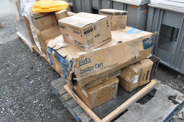 Boxes of various "scratch and dent" items on a pallet, including Acopa stemless flute glasses and BM176IB100 ingredient bin.