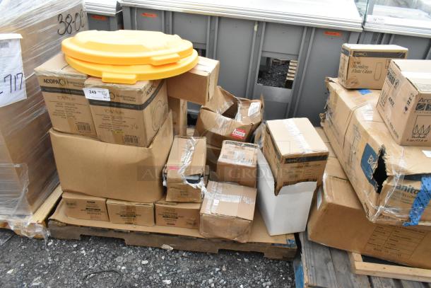 Various boxed items on a pallet, including Acopa glassware and Yanco plates. Some boxes are slightly damaged.