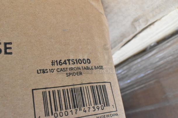 Cardboard box labeled #164TS1000 LT&S 10" Cast Iron Table Base Spider, showing barcode and "Made in China."