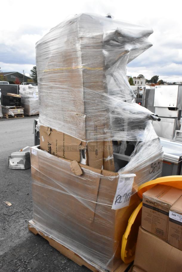 Pallet of 8 scratch and dent items, including Regency stainless steel work table and shelves, wrapped in plastic.