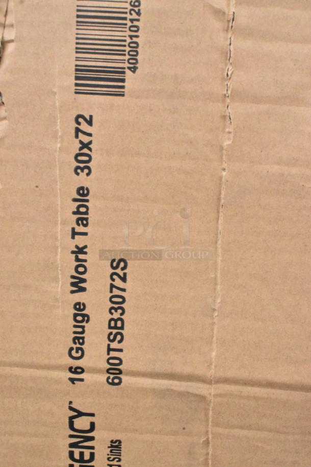Cardboard box labeled "16 Gauge Work Table 30x72, 600TSB3072S," indicating a Regency stainless steel table.