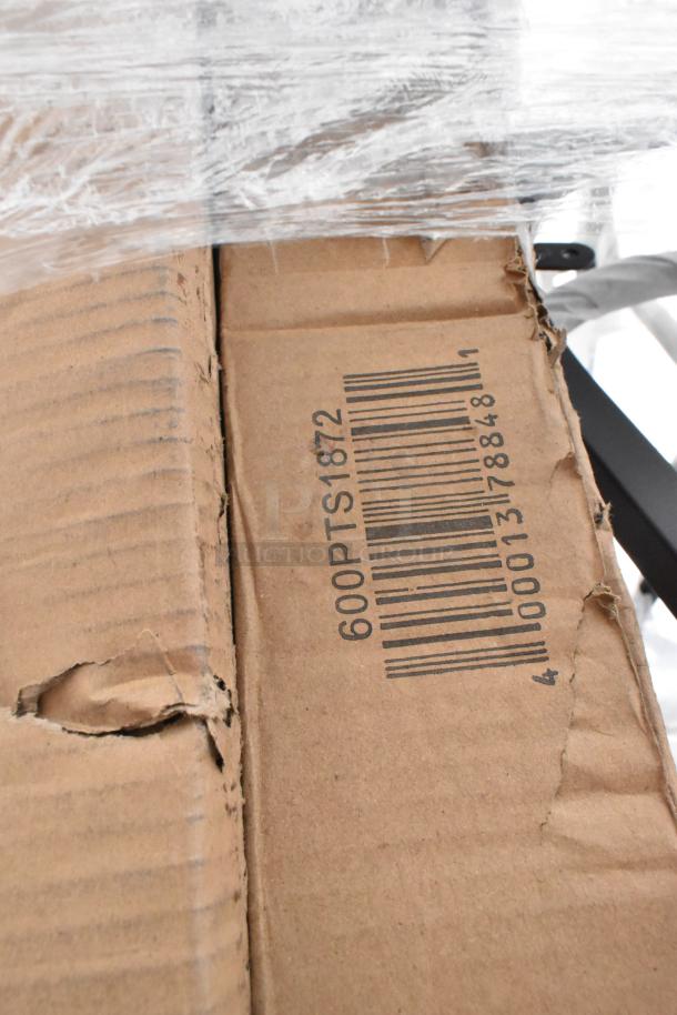 Cardboard box with visible barcode labeled "600PTS1872," slightly damaged, showing signs of wear.