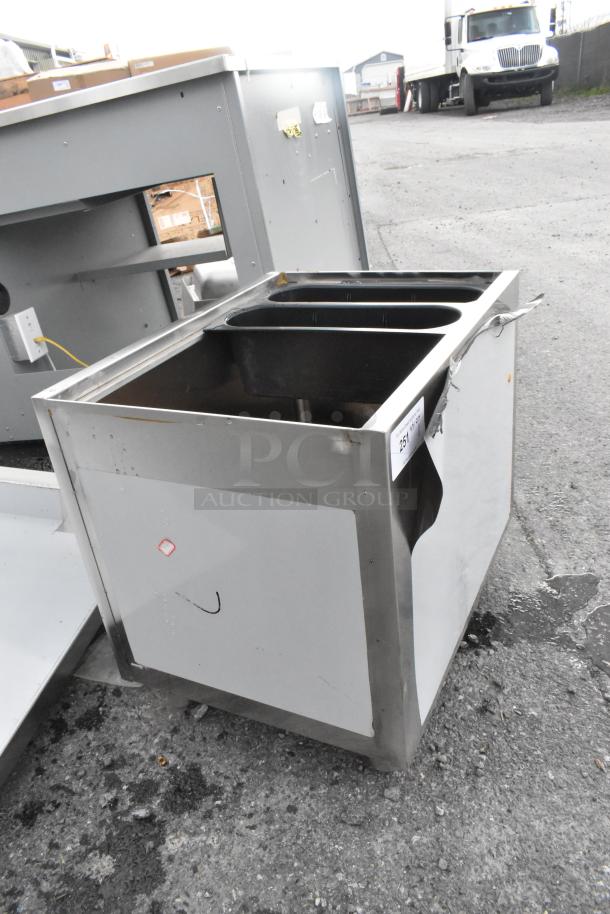 Brand new Regency 24"x18" stainless steel portable ice bin, with visible dents and scratches, model 600IB1824M.