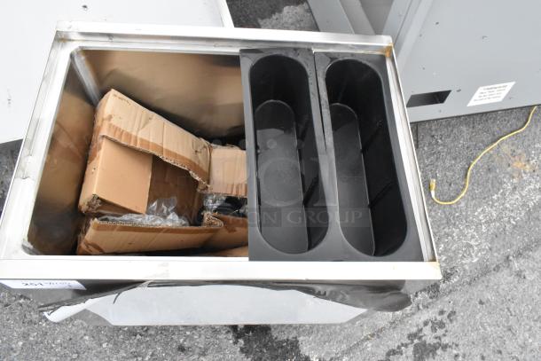 BRAND NEW Regency 600IB1824M 24" x 18" stainless steel ice bin, with slight scratches and dents visible. Portable, durable design.