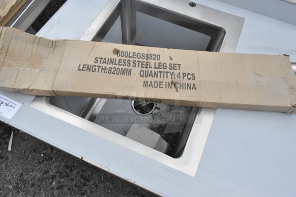 Brand new Regency 600ST3072L 30"x72" stainless steel tabletop with left sink, includes leg set. Some scratches visible.
