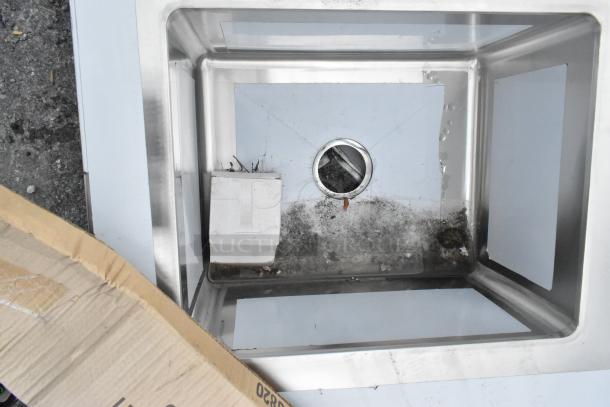 Brand new Regency 600ST3072L 30"x72" stainless steel work tabletop with left sink, 16 gauge, visible scratches and dents.