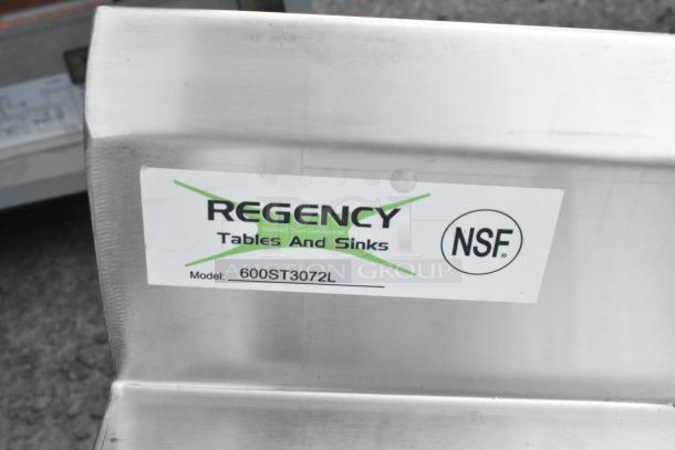 Stainless steel work tabletop with sink, model 600ST3072L by Regency; slight scratches; NSF logo visible.