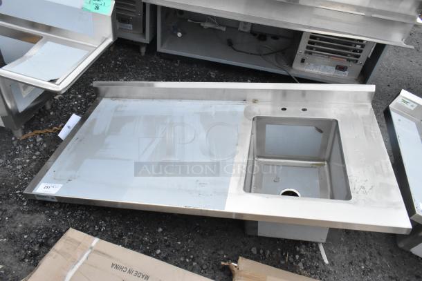 Brand new Regency 600ST3060R stainless steel table with sink basin, minor scratches, includes under-shelf.