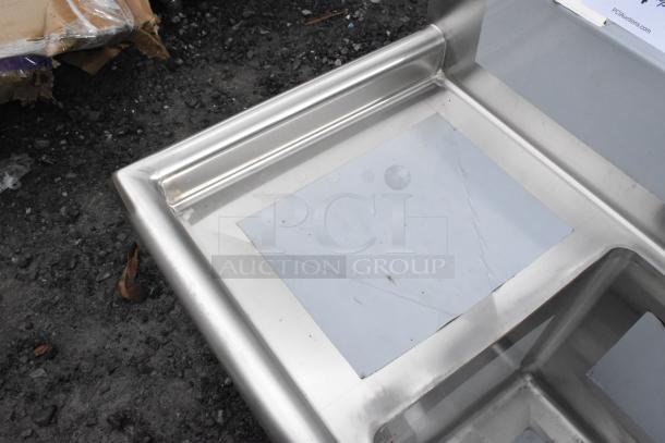 BRAND NEW SCRATCH AND DENT Regency 600S3141414C stainless steel 3-bay L-shaped sink, dual drain boards, no legs.