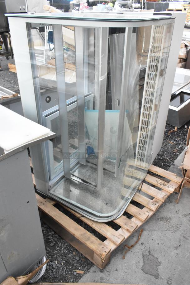 Brand new Avantco 193BC48HCW 48" curved glass white refrigerated bakery display case. Glass damage visible. 115V, 1 phase.